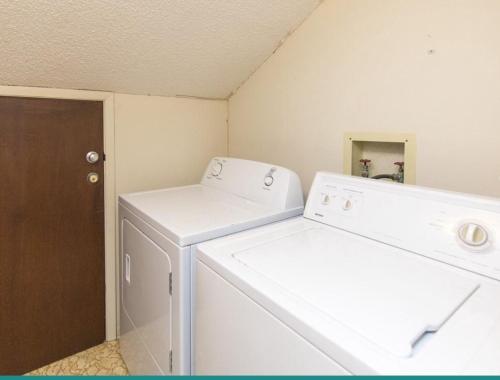 a laundry room with a washer and dryer at Sea Bluff #5 in Santa Rosa Beach