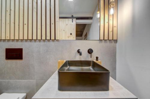 a kitchen with a stainless steel sink on a counter at New Maisonette in the Centre of Naxxar in Il-Ħamrija