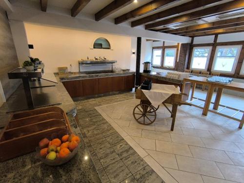 a large kitchen with a bowl of fruit on the floor at Smart Resorts B&B 1 BB1 215 in Winterberg