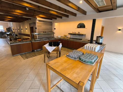 a large kitchen with wooden tables in a room at Smart Resorts B&B 2 BB2 326 in Winterberg