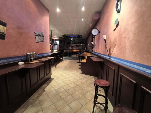 a restaurant with a bar with a clock on the wall at Smart Resorts B&B 2 BB2 320 in Winterberg