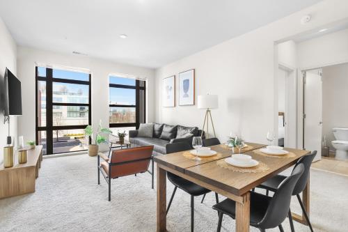 a living room with a table and a couch at The Leisure & The Work Mixed In One-Site in Arlington