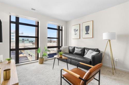 a living room with a couch and a table at The Leisure & The Work Mixed In One-Site in Arlington