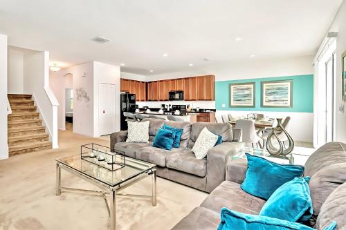 a living room with a couch and a table at Family Home with Cinema Pool and BBQ Near Disney in Kissimmee