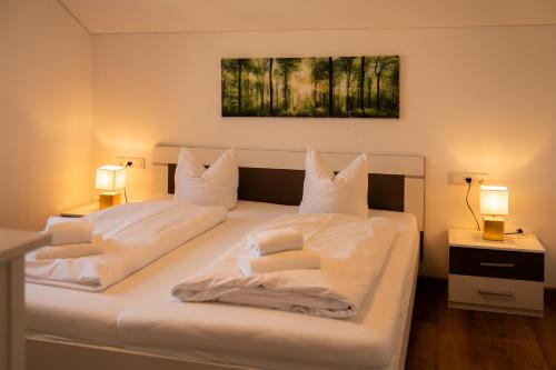 Postel nebo postele na pokoji v ubytování homy Central City Oasis in Dornbirn