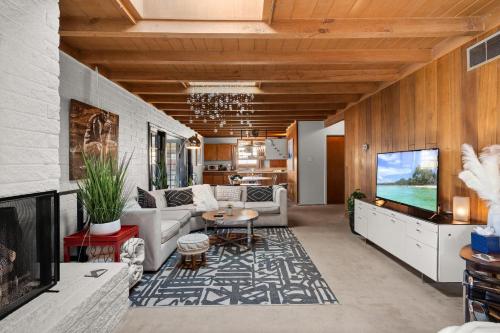 a living room with a couch and a table at Casa de La Rosa in Santa Fe NM in Santa Fe