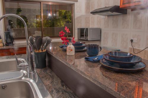 Η κουζίνα ή μικρή κουζίνα στο Chello's Villa