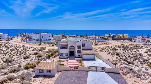 an aerial view of a house in the desert at A Wave FROM IT ALL in Las Conchas