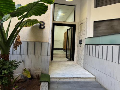 a hallway of a house with a glass door at Studio Appartement MIRAMAR in Mohammedia