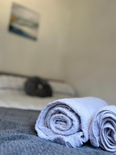 Ένα ή περισσότερα κρεβάτια σε δωμάτιο στο The Cozy Inn