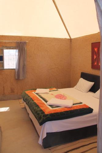 Postel nebo postele na pokoji v ubytování Ngayan Camp