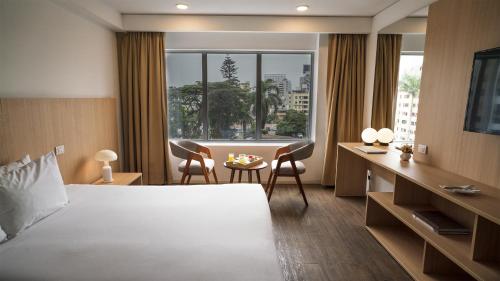 Rúm í herbergi á Dazzler by Wyndham Lima Miraflores