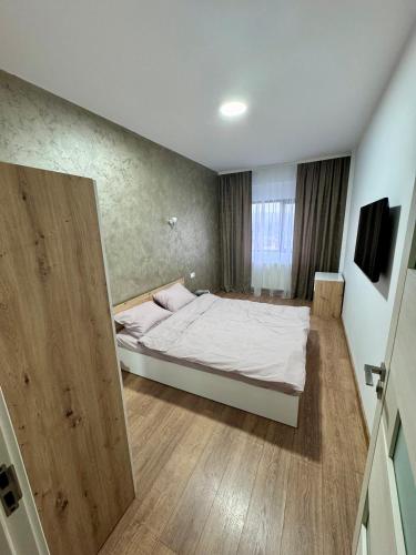 Postel nebo postele na pokoji v ubytování Apartament