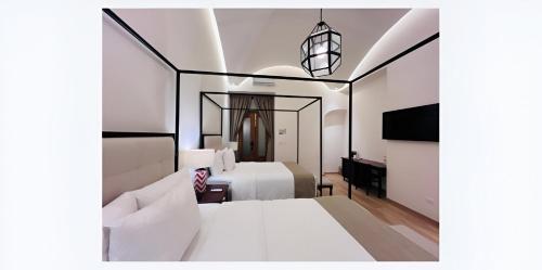 Casa Haus Hotel Puebla Centro Históricoにあるベッド