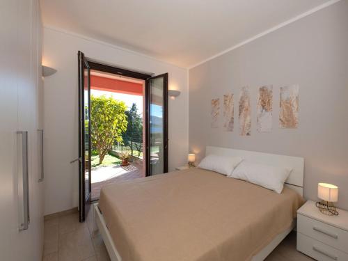Ένα ή περισσότερα κρεβάτια σε δωμάτιο στο Apartment Anna by Interhome