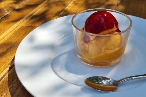 a dessert in a glass on a plate with a spoon at Agriturismo Fara del Falco in Vieste