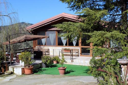 a house with potted plants in front of it at Agriturismo Fara del Falco in Vieste