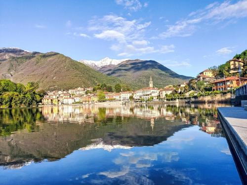 a town on a lake with mountains in the background at Apartment Bac 2 by Interhome in Mergozzo