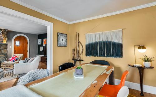a living room with a table and chairs at Asheville Urban Farmhouse Entire Home 4 mi to DT in Asheville