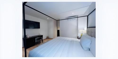 Casa Haus Hotel Puebla Centro Históricoにあるベッド