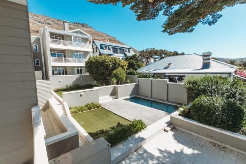 an aerial view of the backyard of a house with a swimming pool at Restore your Soul, Boulders Beach, Seaforth, Simon's Town in Simonʼs Town