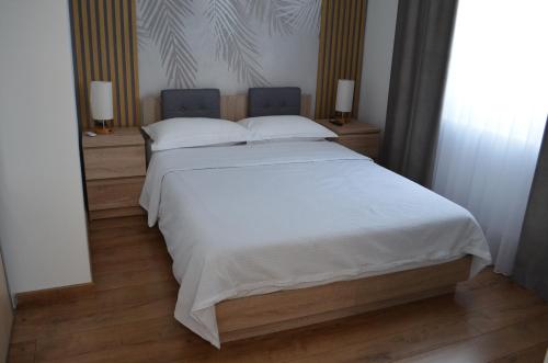 Postel nebo postele na pokoji v ubytování ApartHotel