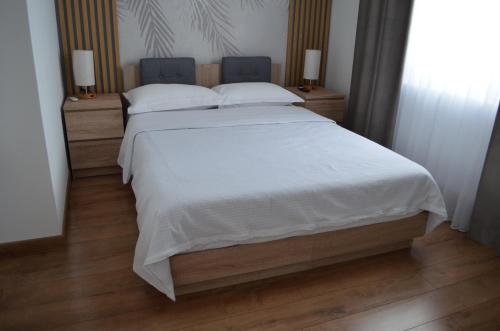 Postel nebo postele na pokoji v ubytování ApartHotel