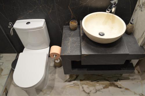 Koupelna v ubytování ApartHotel