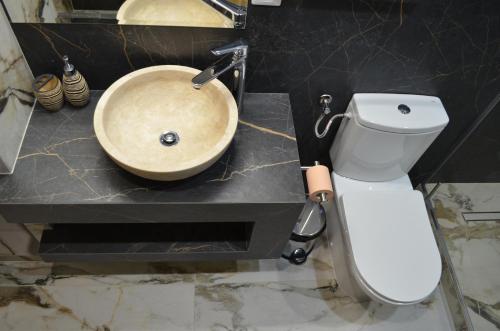 Koupelna v ubytování ApartHotel