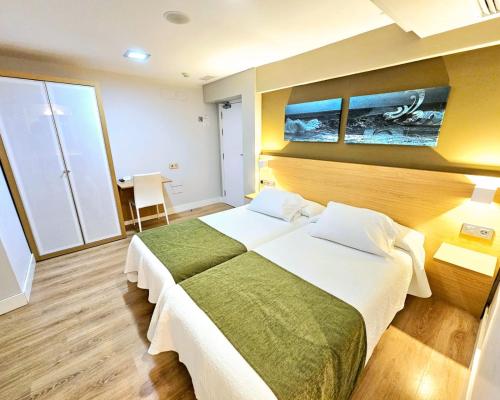 Postel nebo postele na pokoji v ubytování Hotel Olatu