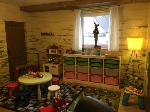 a toy room with a table and a window at Willa pod Czantorią SPA Ustroń in Ustroń
