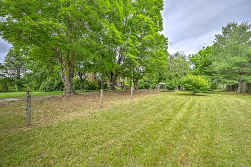 a fence in a field with trees in the background at Asheville Urban Farmhouse Entire Home 4 mi to DT in Asheville