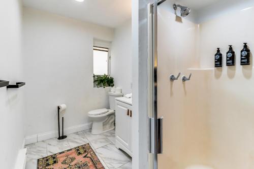 a bathroom with a toilet and a sink at Hot Tub and Seasonal Pool Family Getaway in Cresco in Cresco