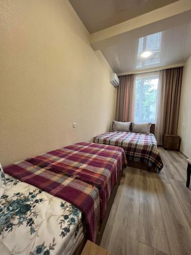 Postel nebo postele na pokoji v ubytování Kolkha - 1Kolkheti street