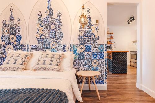 a bedroom with blue and white tiles on the wall at Luxury Boho-Inspired APT in Montreal in Montréal