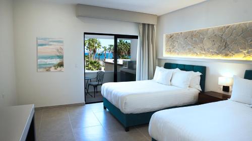 Postel nebo postele na pokoji v ubytování Hotel Loreto Palmar