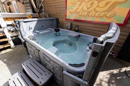 a bath tub in the back of a store at Belmont Family Fun w Hot Tub Pool Game Room King Suite in Belmont