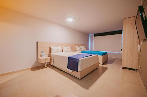 Postel nebo postele na pokoji v ubytování HOTEL VERANO