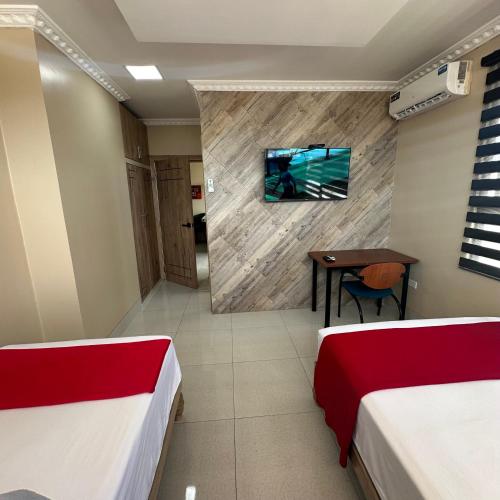 Postel nebo postele na pokoji v ubytování Hotel Murali - Cerca del Aeropuerto de Guayaquil