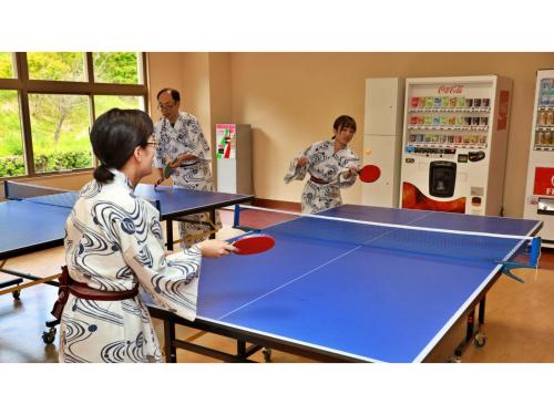 a group of people playing a game of ping pong at Miki no Sato Hotel Miki - Vacation STAY 51868v in Gero