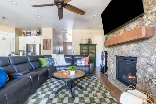 a living room with a couch and a fireplace at Flagstaff Route 66 Retreat in Flagstaff