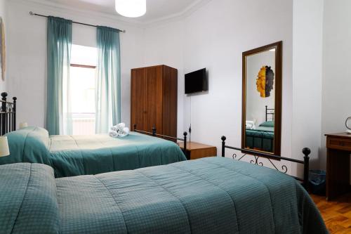 Postel nebo postele na pokoji v ubytování B&B Al Centro