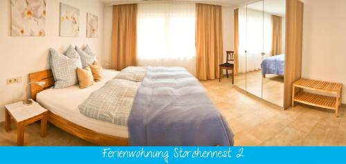 Ferienwohnung Storchennestにあるベッド