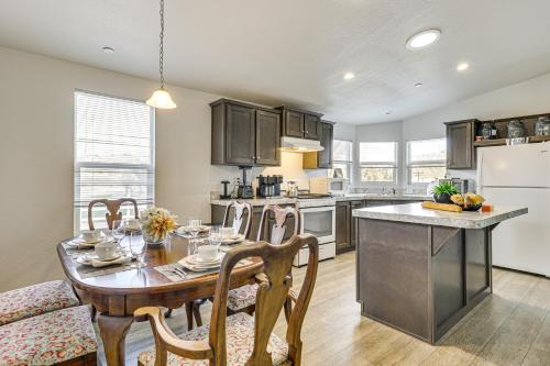 a kitchen with a wooden table and a dining room at Near Ramona Wineries Mtn-View Haven with Large Yard in Ramona