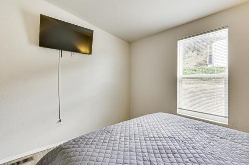 a bedroom with a bed and a window at Near Ramona Wineries Mtn-View Haven with Large Yard in Ramona