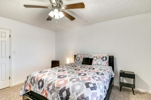 a bedroom with a bed and a ceiling fan at 4 Mi to WKU Hilltoppers Hideaway with Grills! in Bowling Green