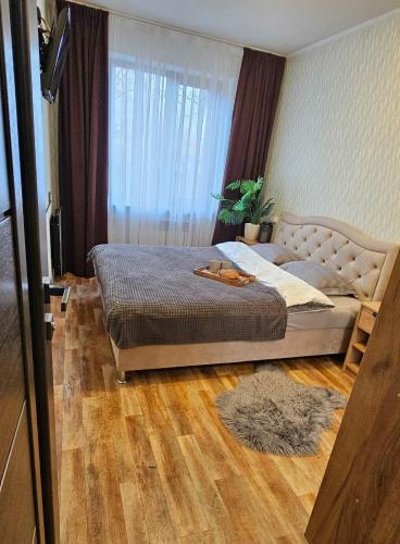 Кровать или кровати в номере Комфортні апартаменти на Гетьманській 74, Святогеоргієвській 15