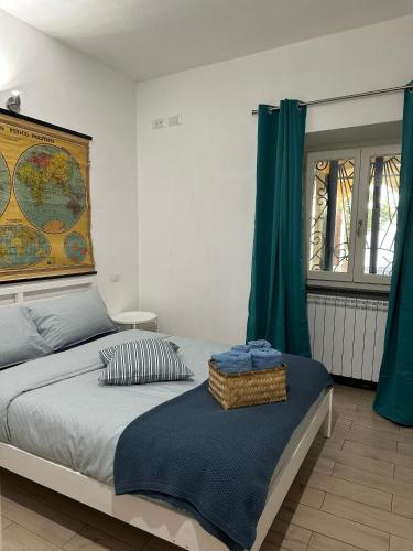 a bedroom with a bed with a map on the wall at Gassa d'Amante in Montaretto