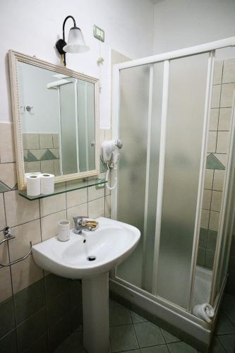 a bathroom with a sink and a shower at B&B Al Centro in Agrigento