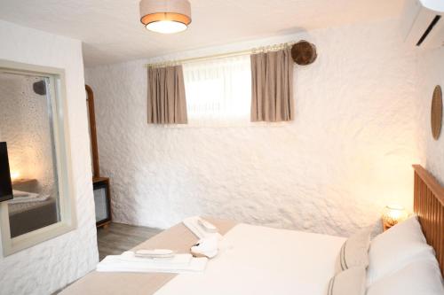 Cama o camas de una habitación en Mahzen Alaçatı